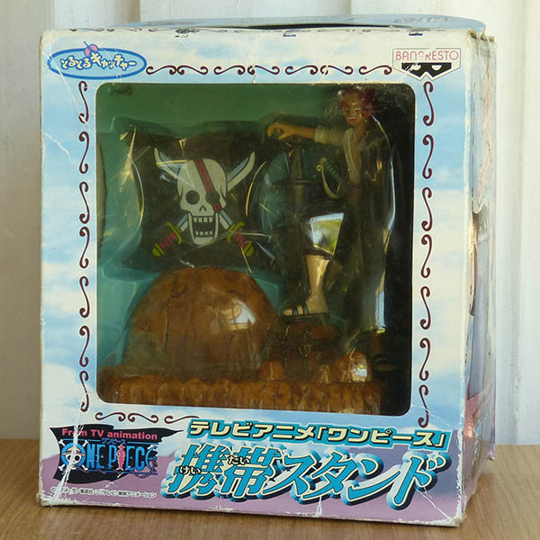 Torutoru Catcher  One Piece  Shanks con Stand para Celular